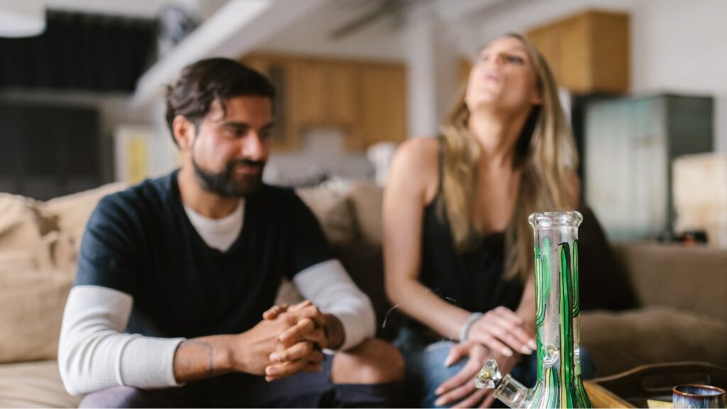 Couple consuming cannabis after dispensary delivery in MA