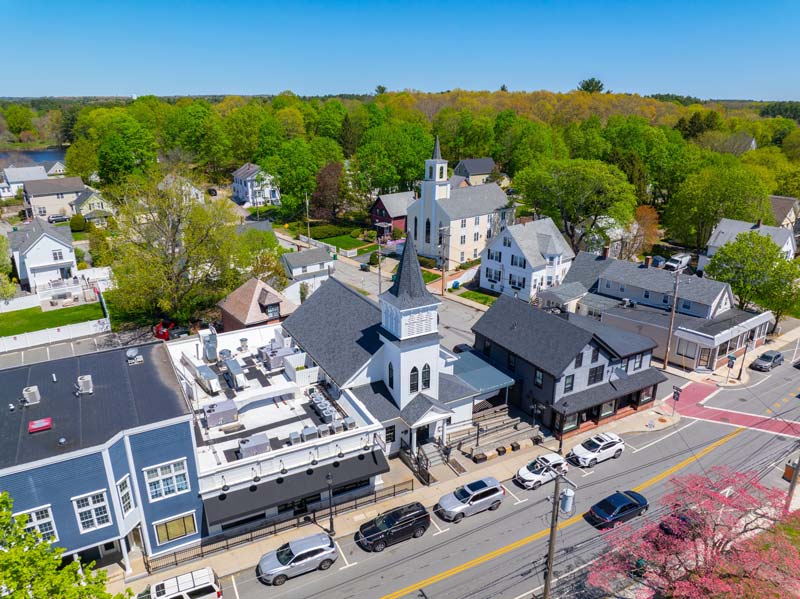 Historic commercial buildings aerial view on Main Street in village of North Easton, town of Easton, Bristol County, Massachusetts MA, USA. Used to illustrate the town of Easton in this section about marijuana delivery in easton ma.